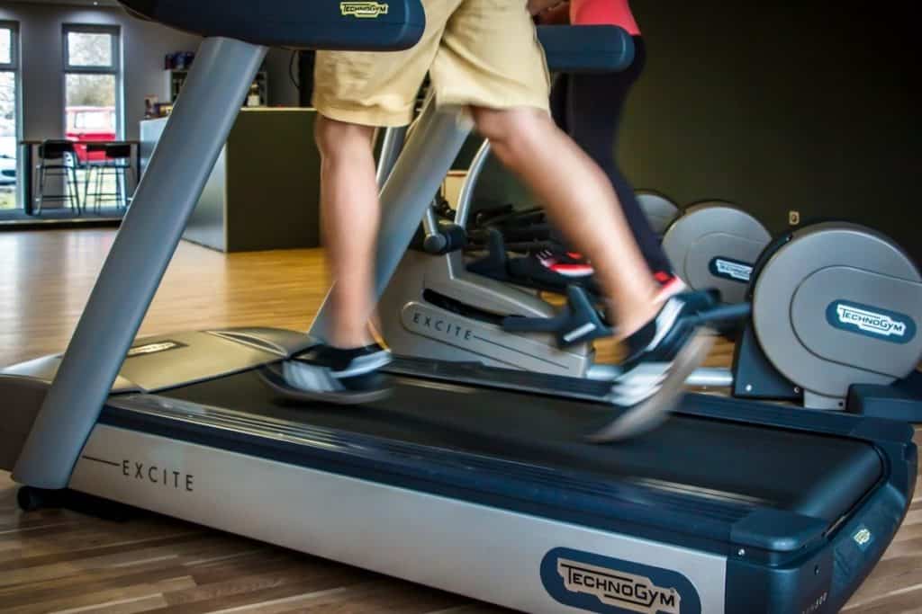 person running on treadmill (physical fitness)
